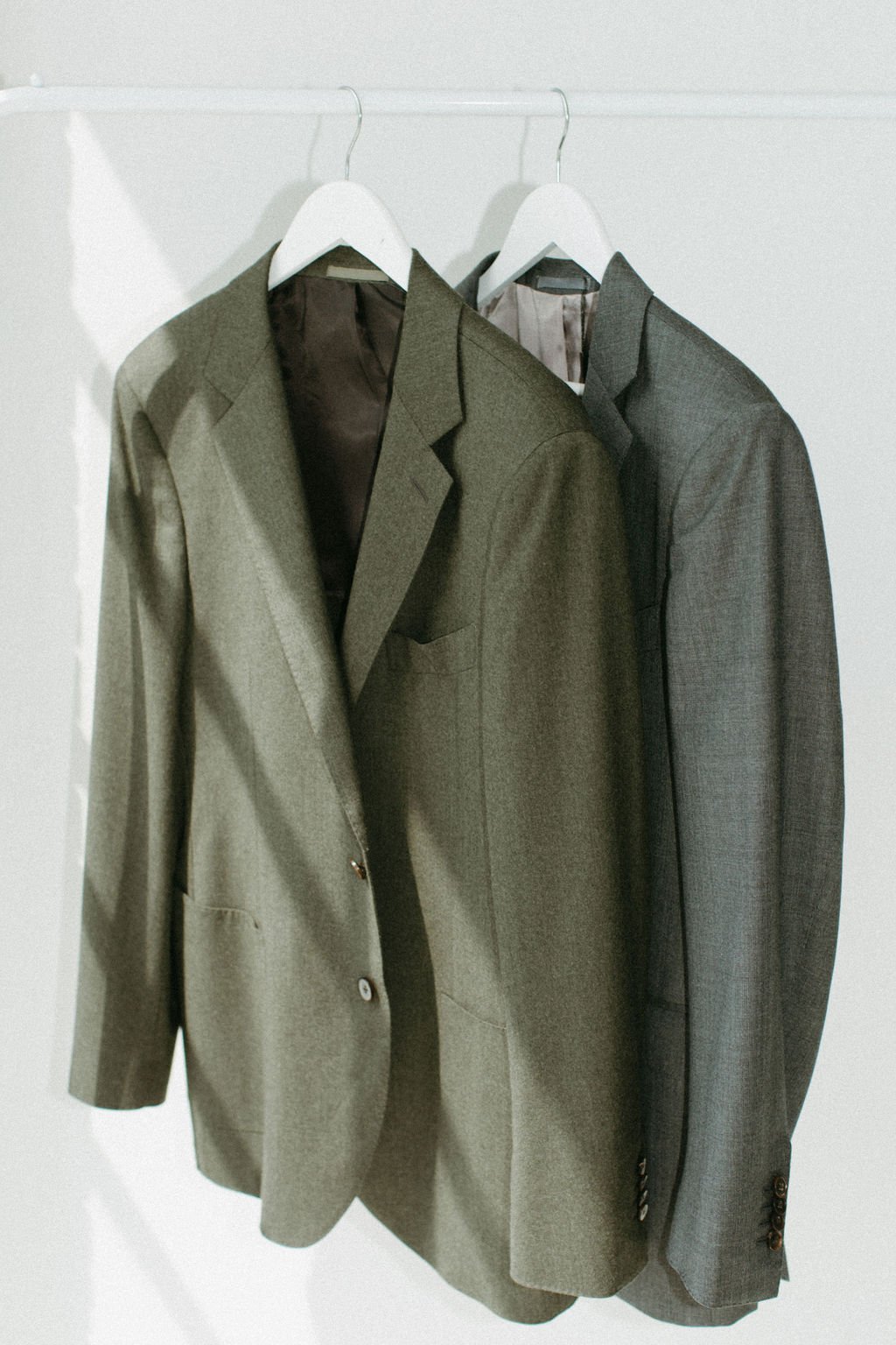 James suit jackets on a rail