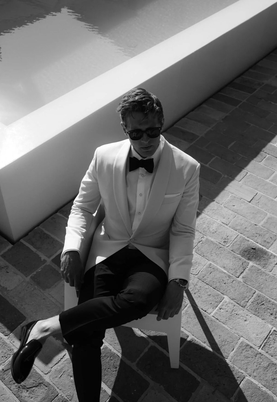 Groom in a white dinner jacket with bow tie